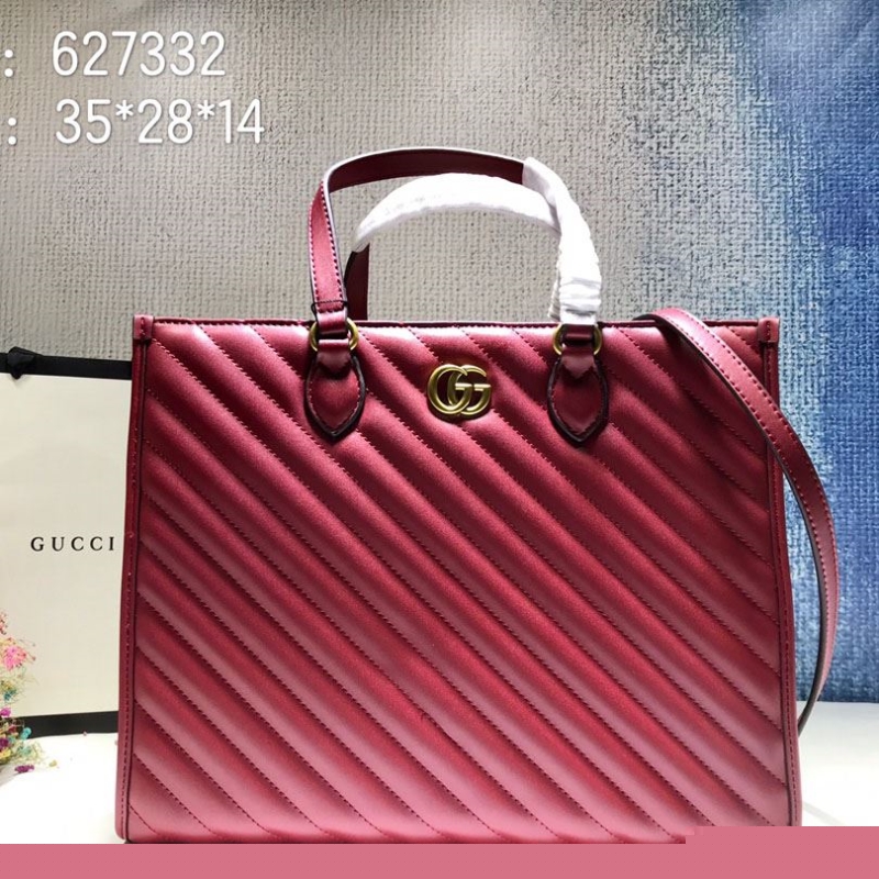 G*u*i shopping bags